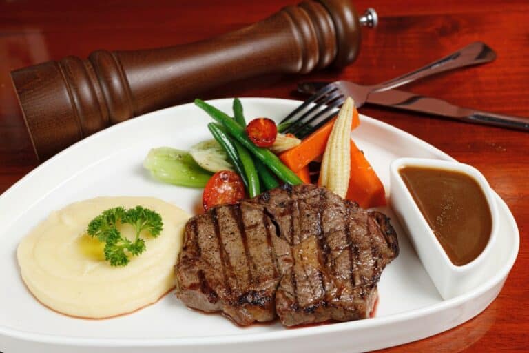 Argentinian rib-eye steak with a choice of sauce: Phu Quoc pepper, green chimichurri or chefs sauce