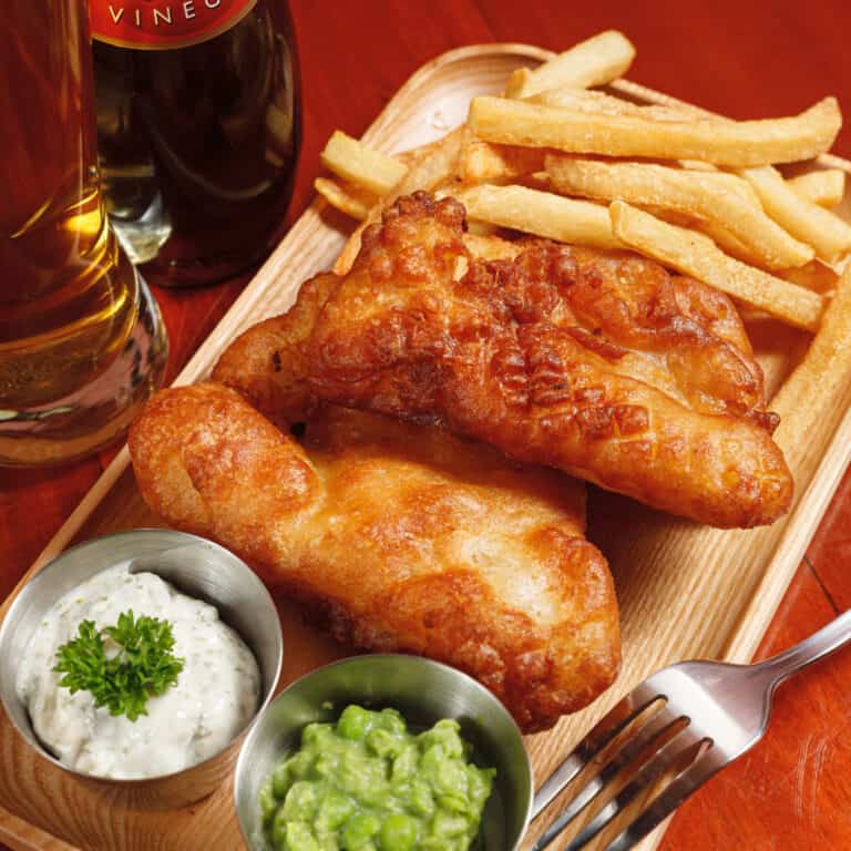 Crispy beer-battered Ling cod with french fries, mushy peas & house-made tartare sauce
